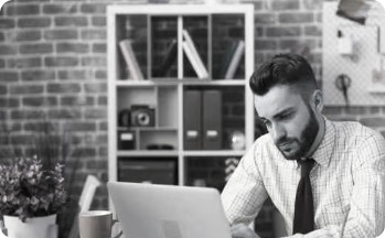 PR agency team member reviewing awards submissions on a laptop